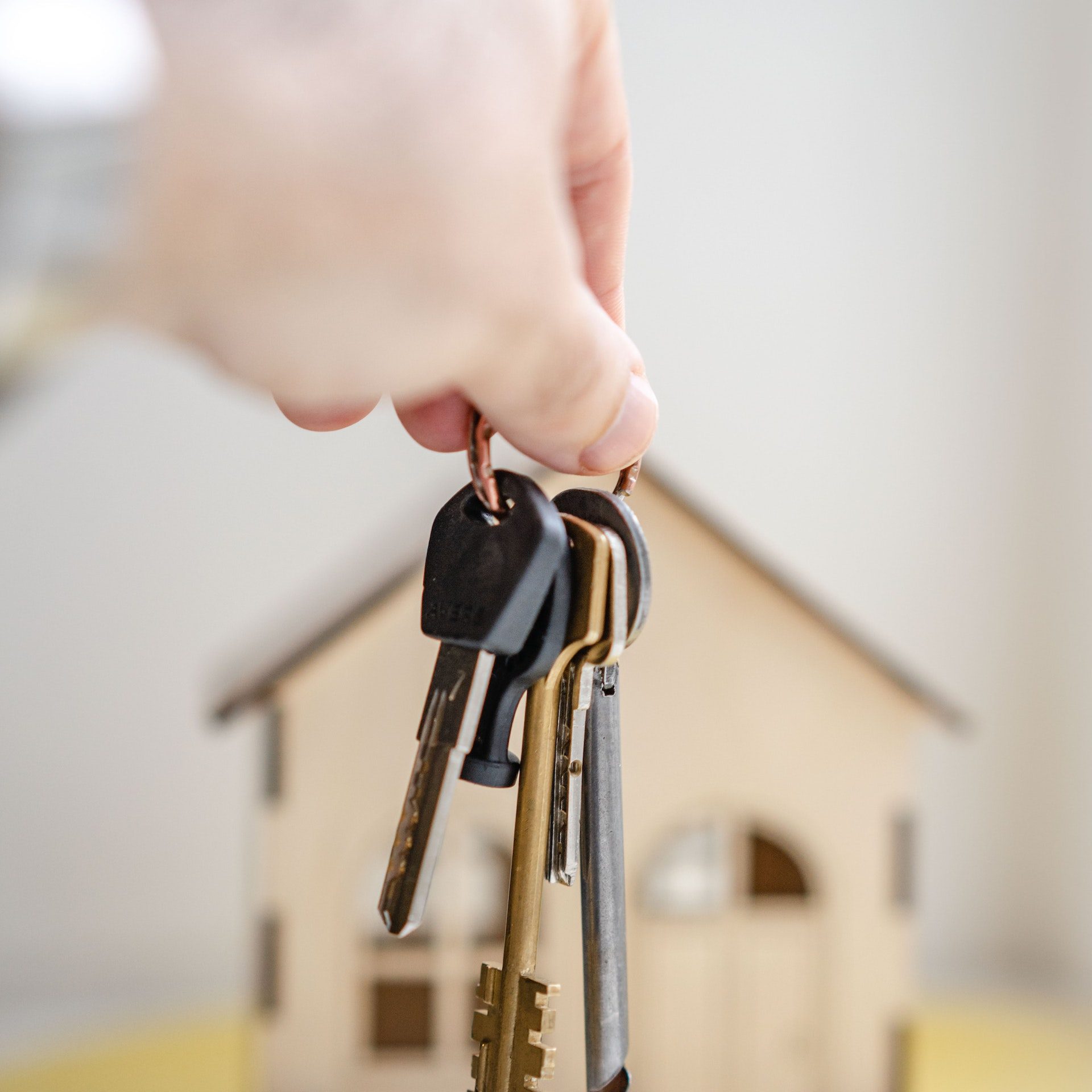 Person with keys for real estate